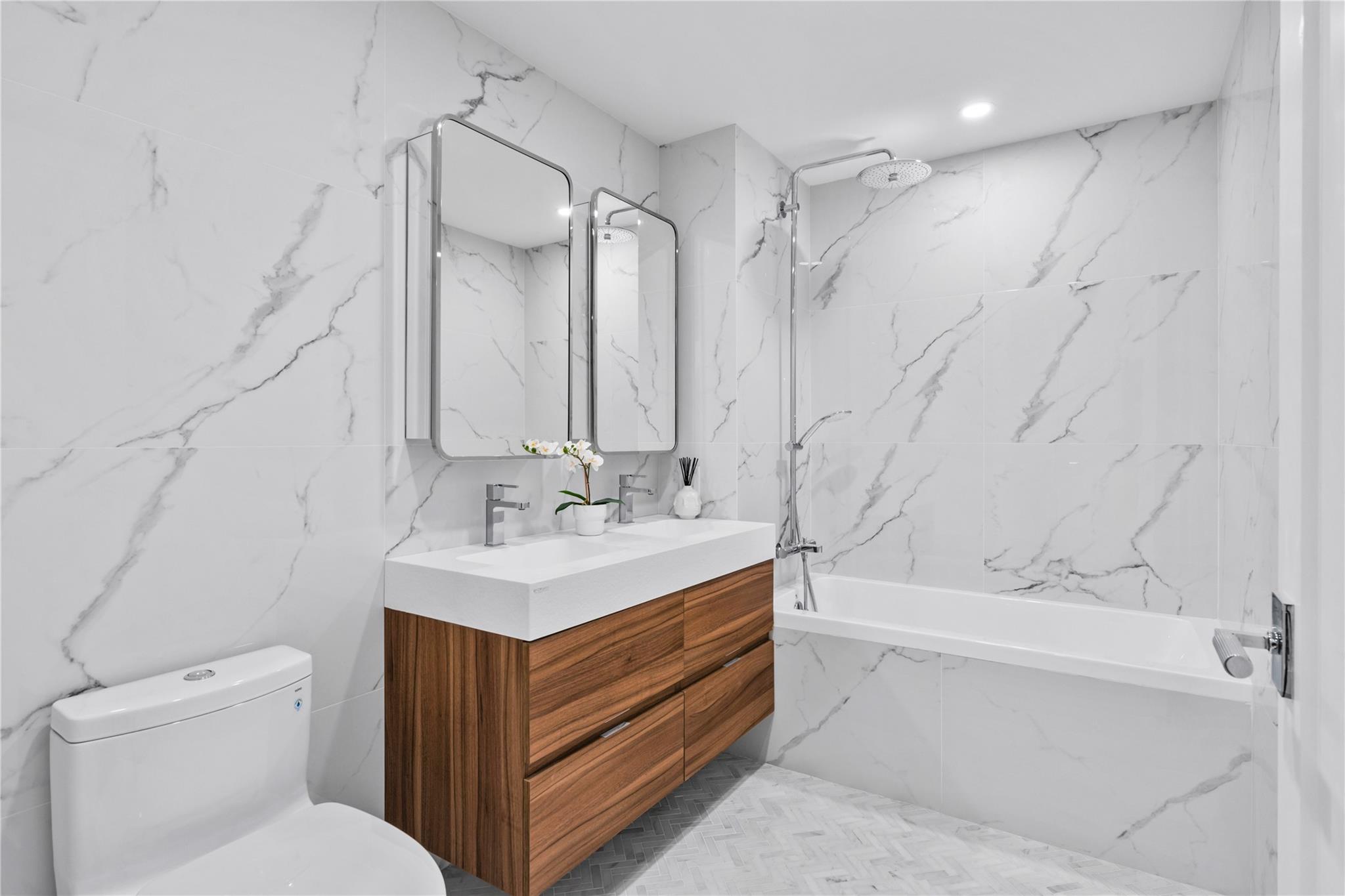 78-29 Austin Street, Unit PH1C Queens, NY 11375 - Photo 11 of 27 a bathroom with a sink toilet vanity and tub