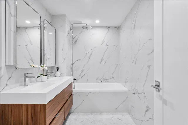 a bathroom with a bathtub and a sink