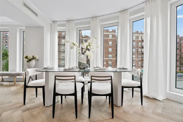 a dining room with furniture and wooden floor