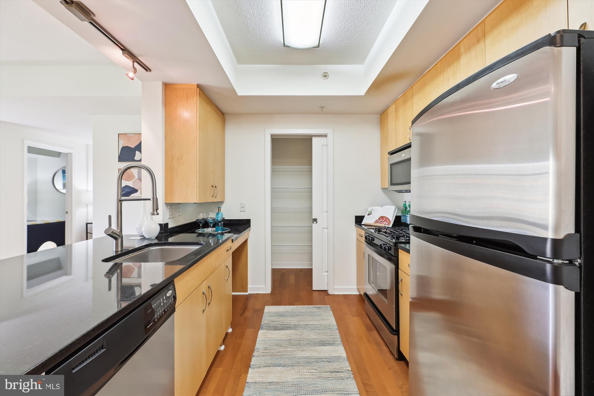 475 K Street Northwest, Unit 626 Washington, DC 20001 - Photo 8 of 59 Kitchen with large pantry and pocket doors