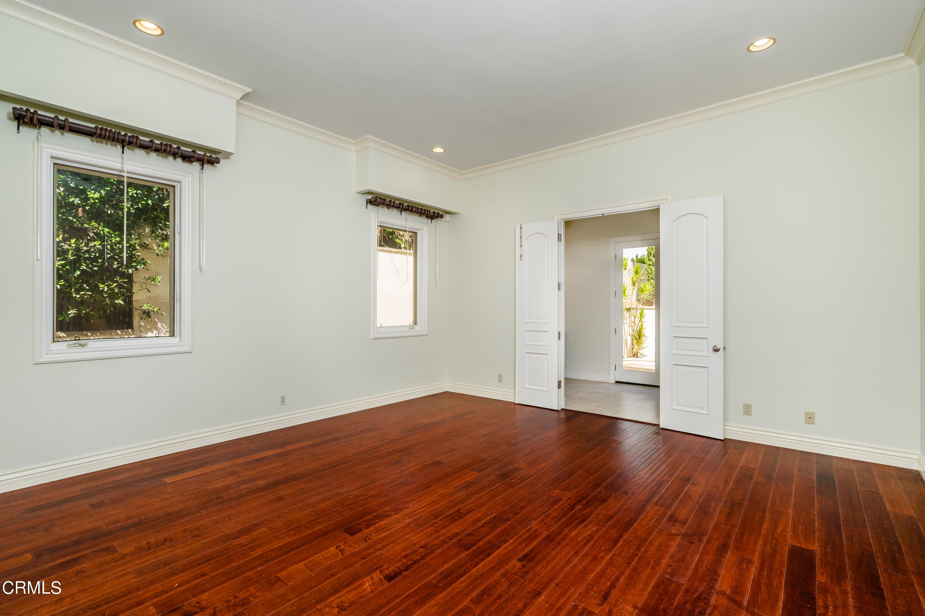 1165 Arden Road Pasadena, CA 91106 - Photo 17 of 25 a view of an empty room with wooden floor and a window