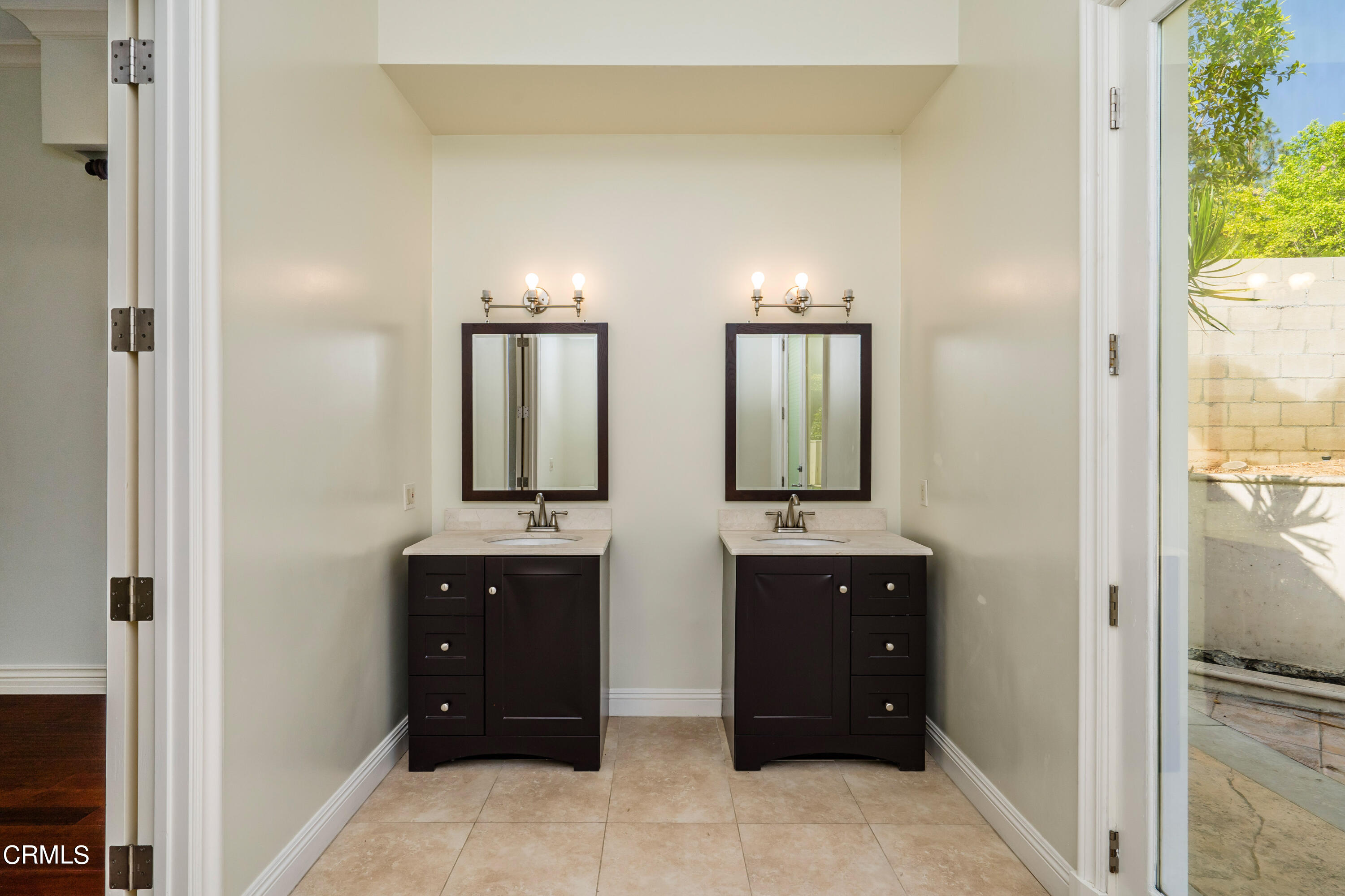 1165 Arden Road Pasadena, CA 91106 - Photo 18 of 25 a bathroom with double vanity and two mirror