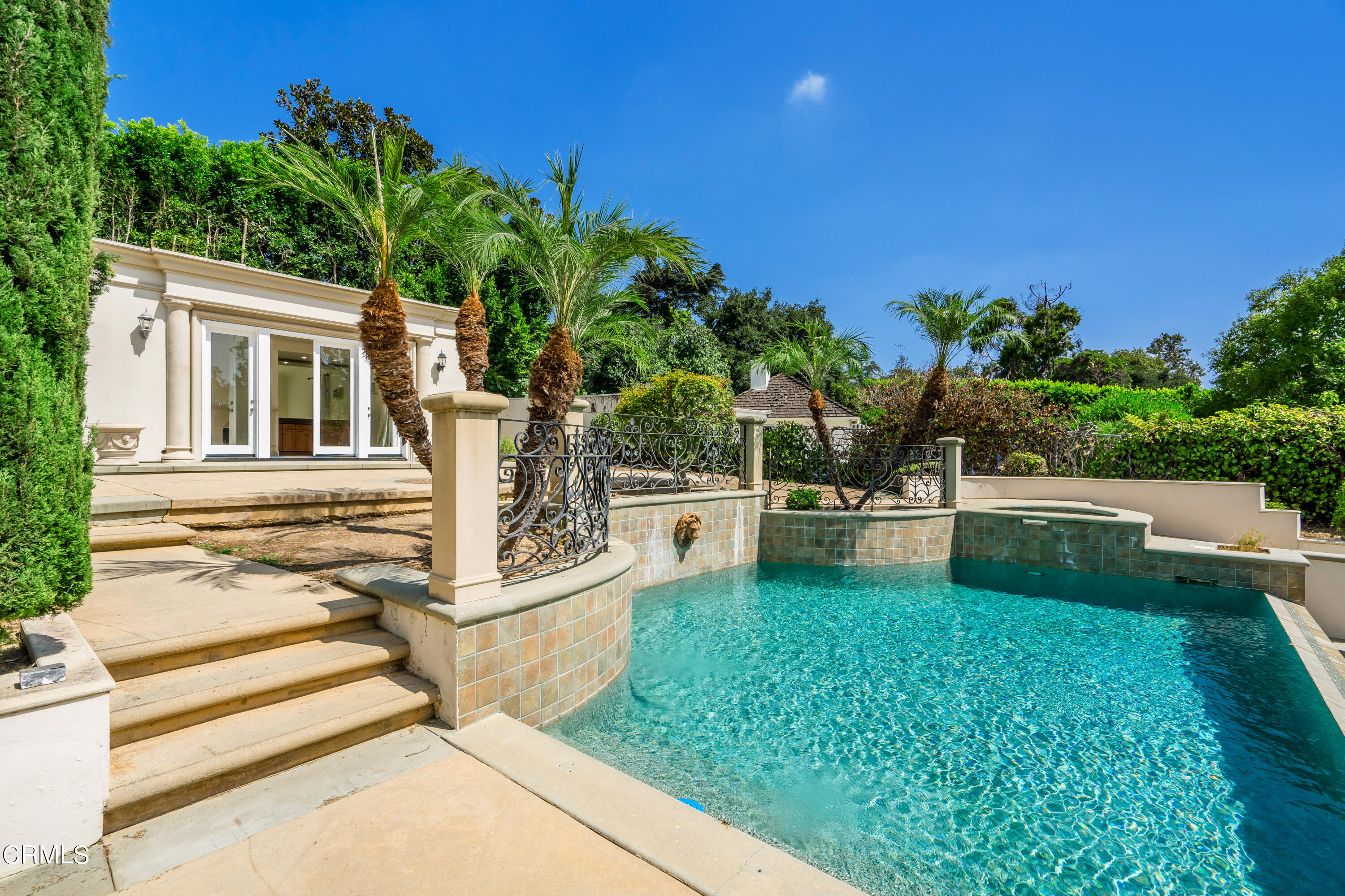 1165 Arden Road Pasadena, CA 91106 - Photo 22 of 25 a view of a patio with table and chairs and potted plants with wooden floor and fence