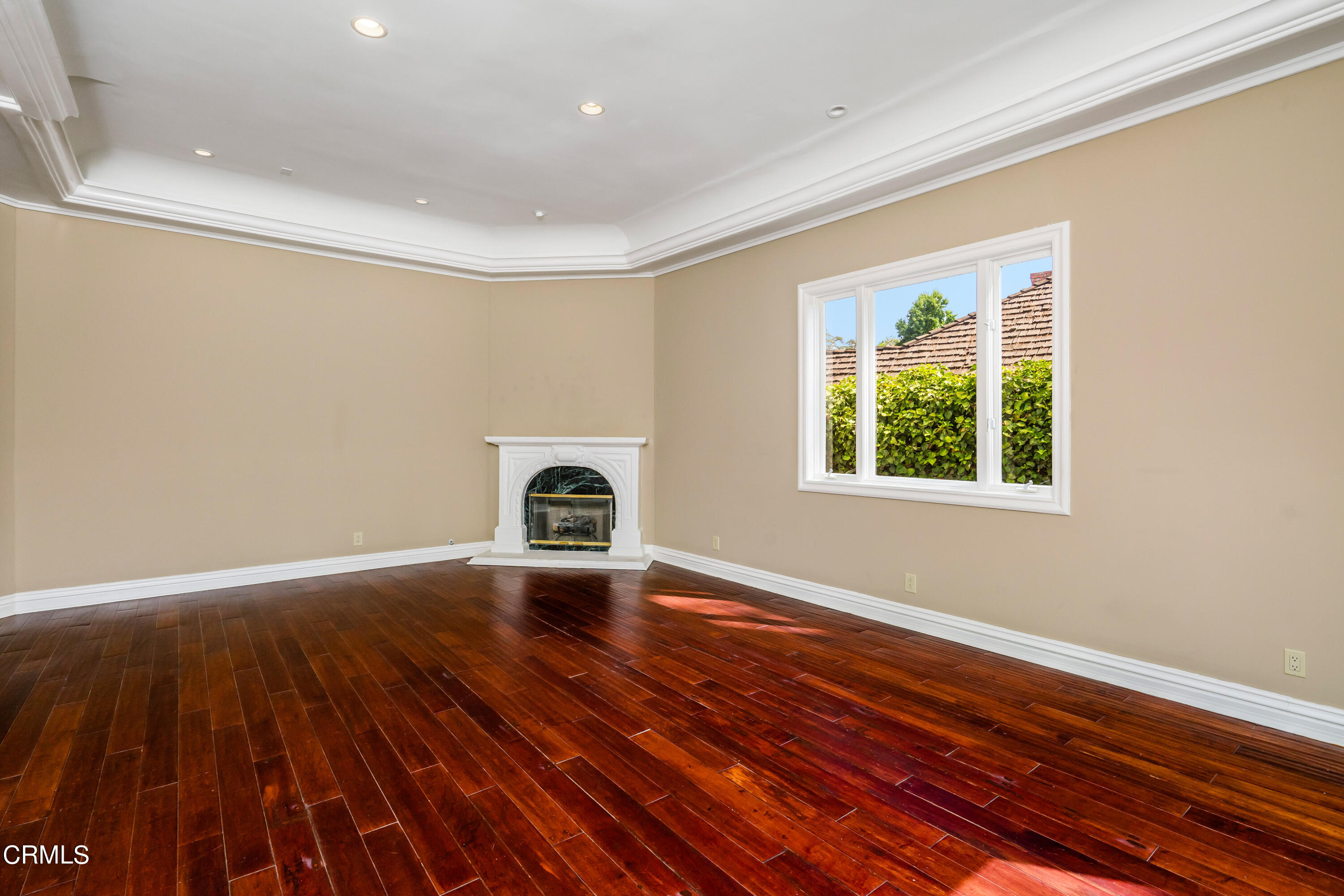 1165 Arden Road Pasadena, CA 91106 - Photo 7 of 25 a view of an empty room with wooden floor and a window