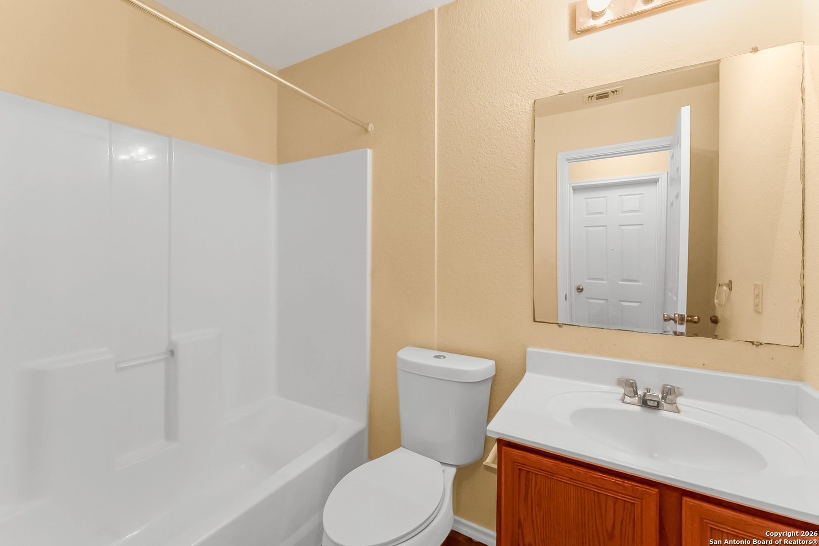 3812 Maverick Crk Road San Antonio, TX 78247 - Photo 17 of 24 a white toilet sitting next to a bathroom sink