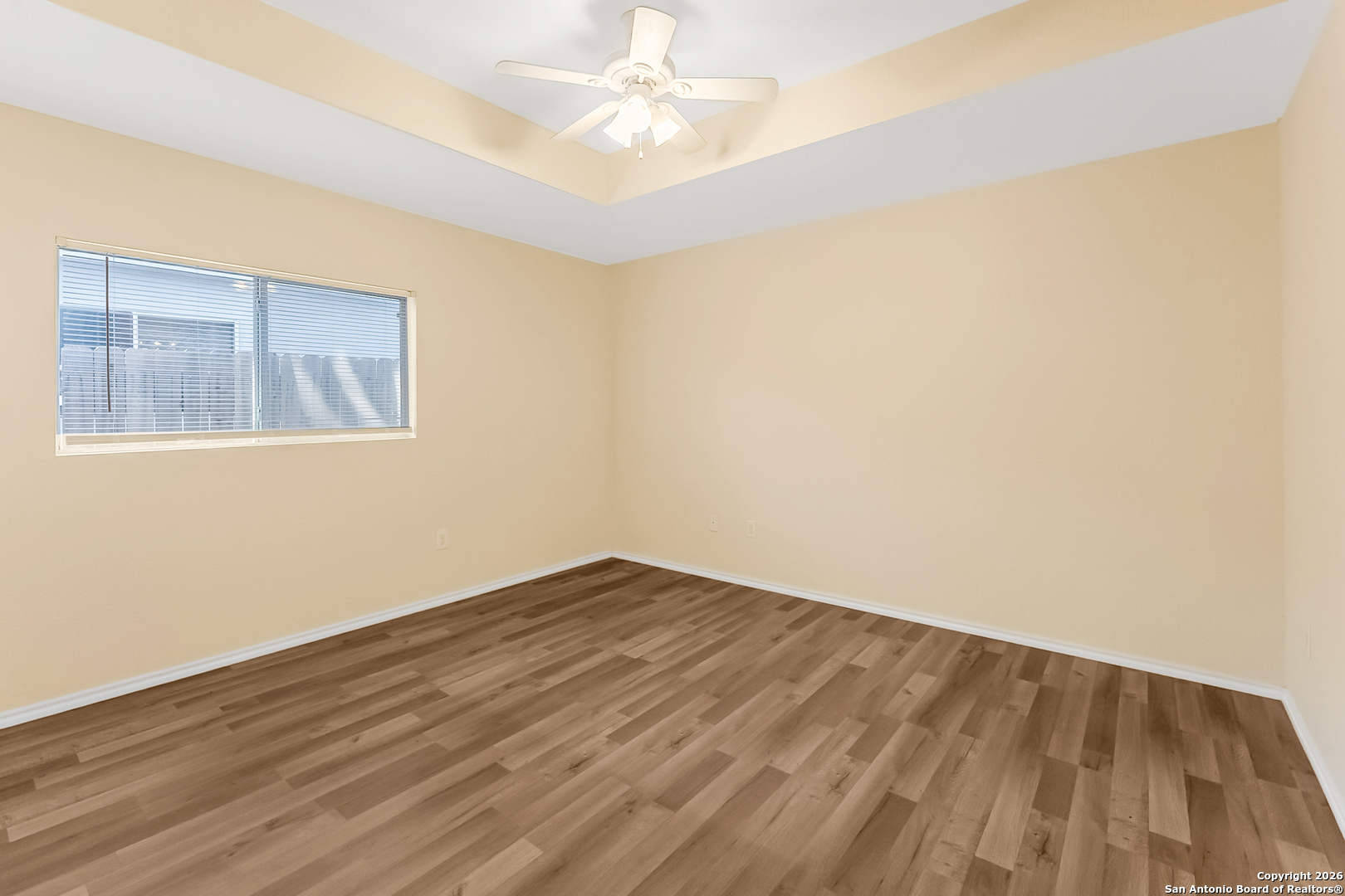 3812 Maverick Crk Road San Antonio, TX 78247 - Photo 18 of 24 an empty room with wooden floor and windows