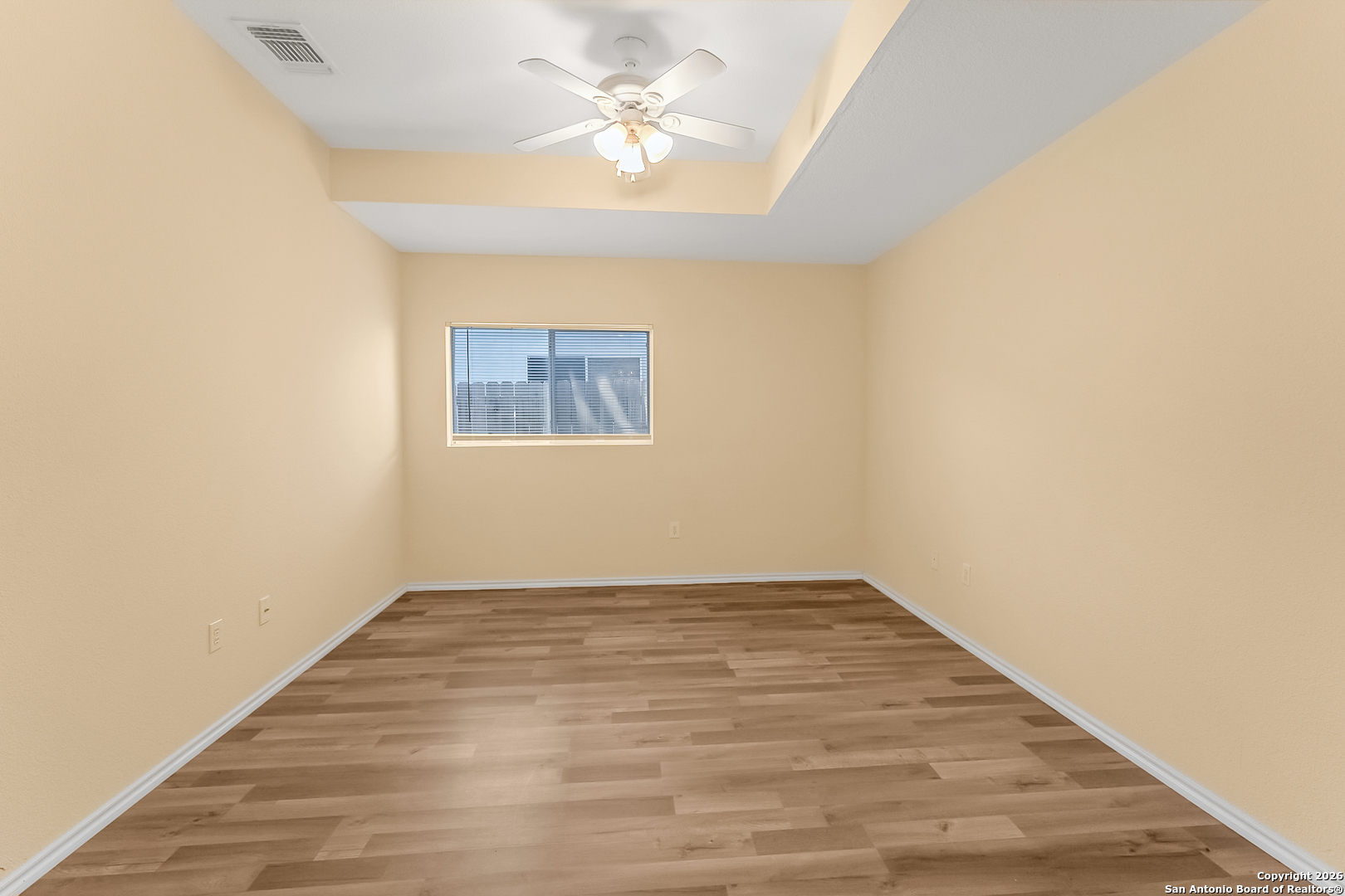 3812 Maverick Crk Road San Antonio, TX 78247 - Photo 20 of 24 wooden floor in an empty room with a window