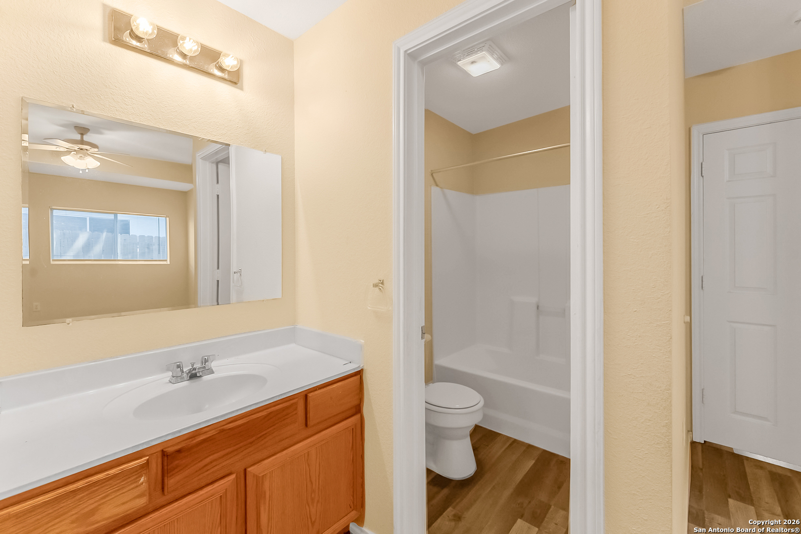3812 Maverick Crk Road San Antonio, TX 78247 - Photo 21 of 24 a bathroom with a granite countertop sink toilet and shower