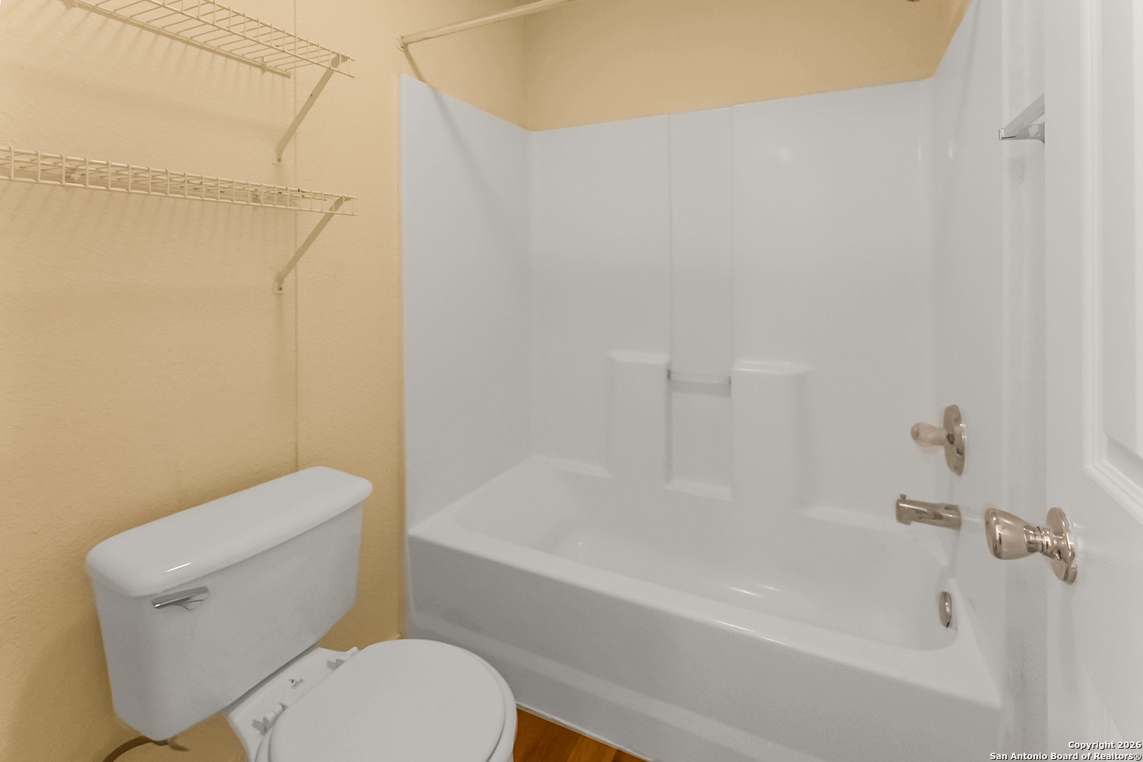 3812 Maverick Crk Road San Antonio, TX 78247 - Photo 22 of 24 a white toilet and tub sitting next to a bathroom sink