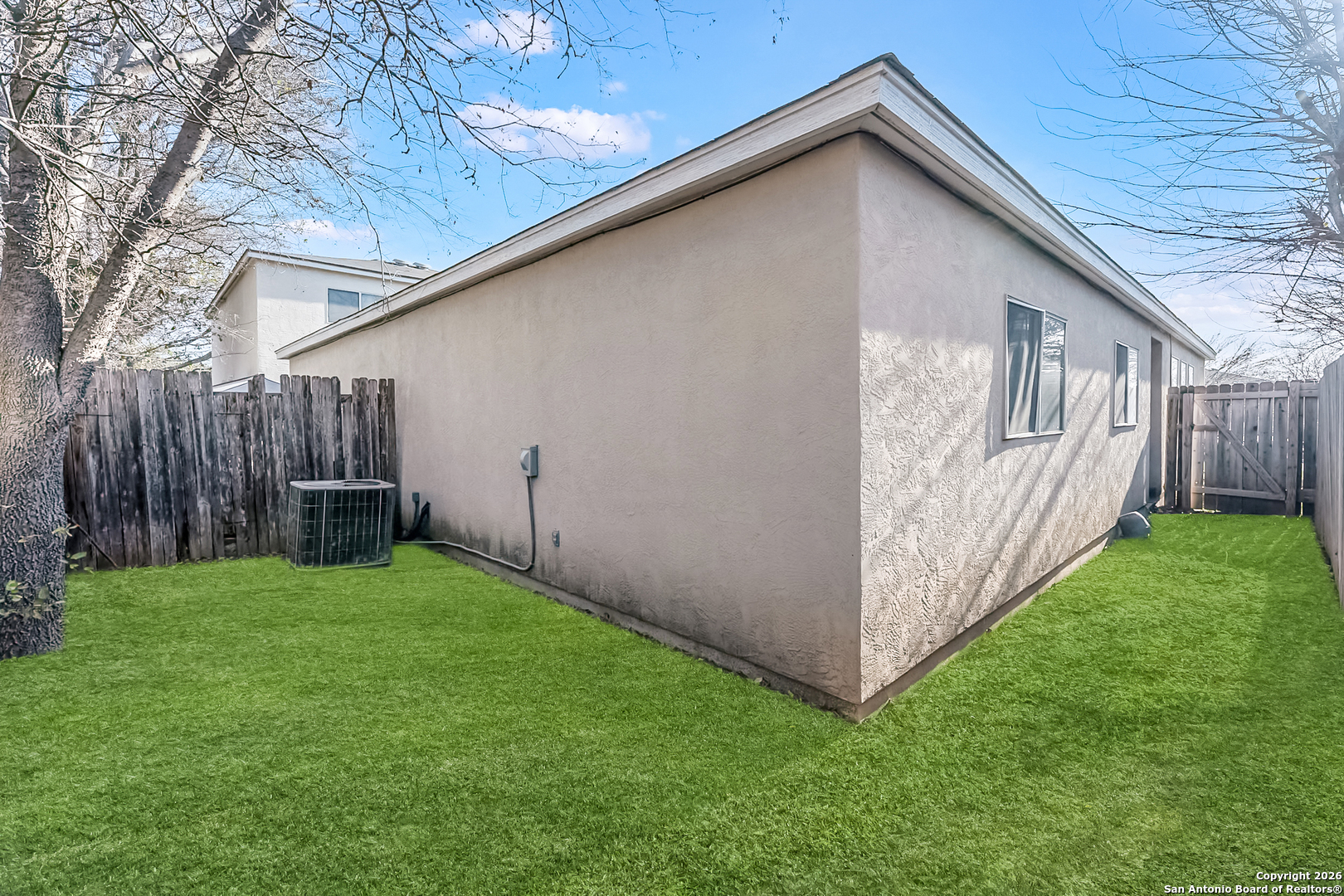 3812 Maverick Crk Road San Antonio, TX 78247 - Photo 23 of 24 a view of a backyard with wooden fence