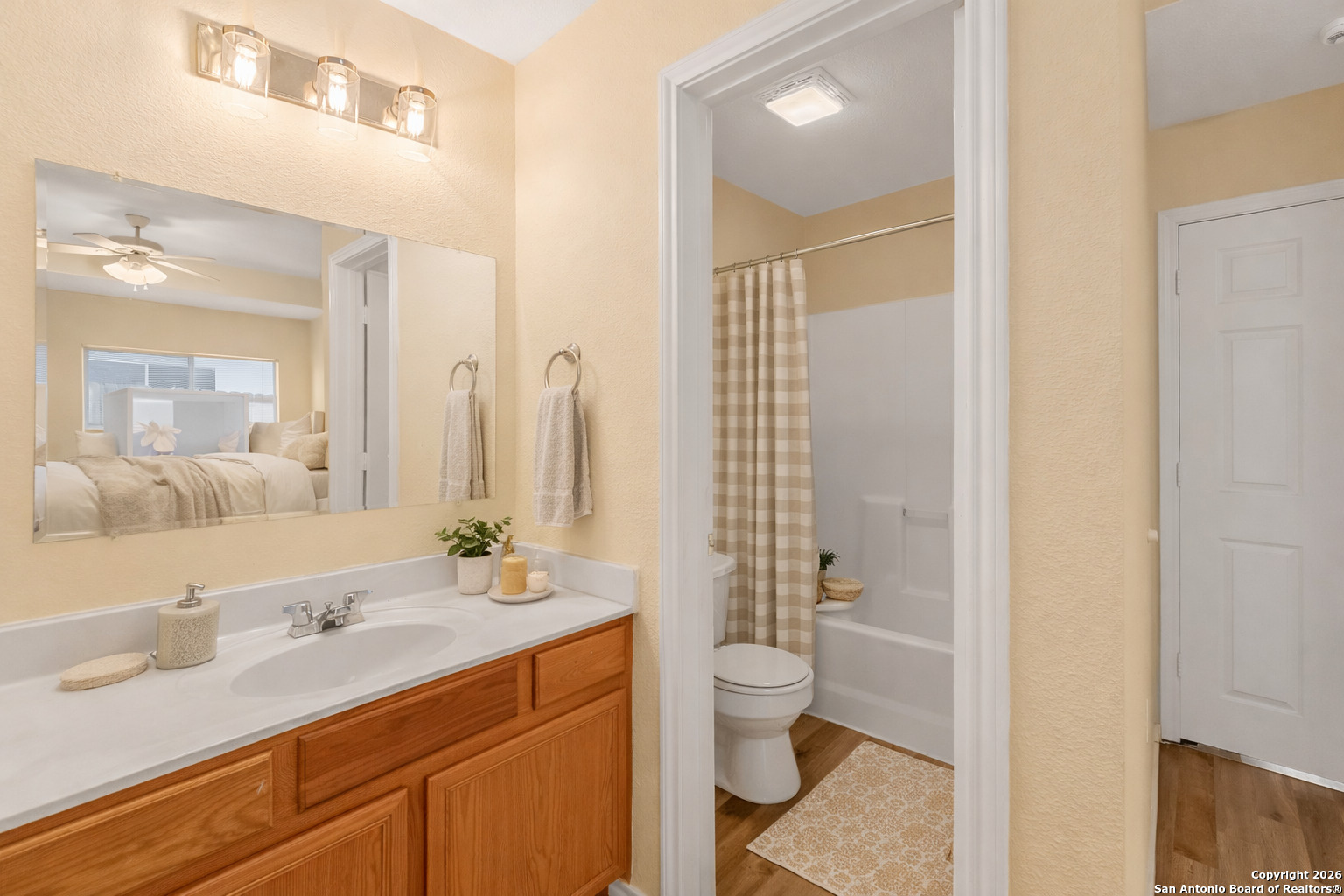 3812 Maverick Crk Road San Antonio, TX 78247 - Photo 8 of 24 a bathroom with a double vanity sink toilet and shower
