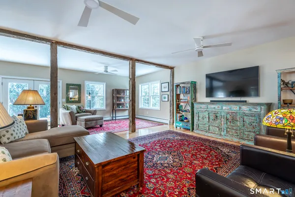 a living room with furniture and a flat screen tv