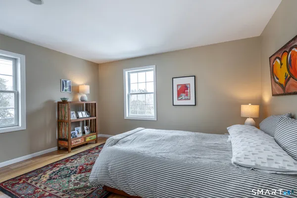 a bedroom with a bed and a bookshelf