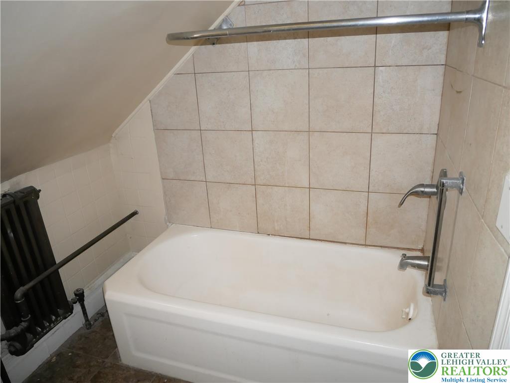 2110 Walnut Street, Unit E Allentown, PA 18104 - Photo 13 of 18 a bathroom with a bathtub