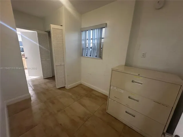 a bathroom with a granite countertop toilet a sink and shower