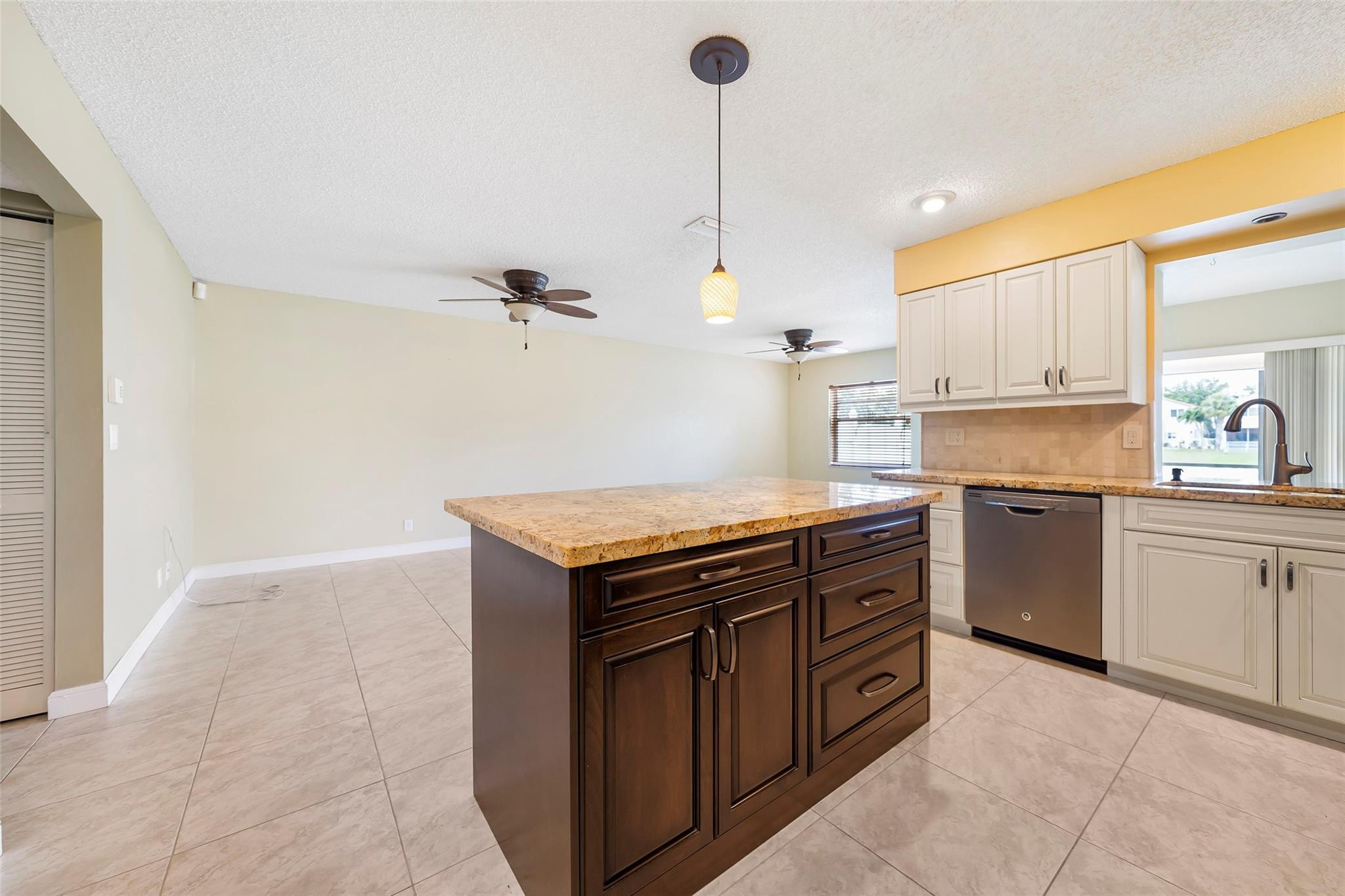 10423 Boca Springs Drive Boca Raton, FL 33428 - Photo 11 of 64 a kitchen with a stove sink and cabinets