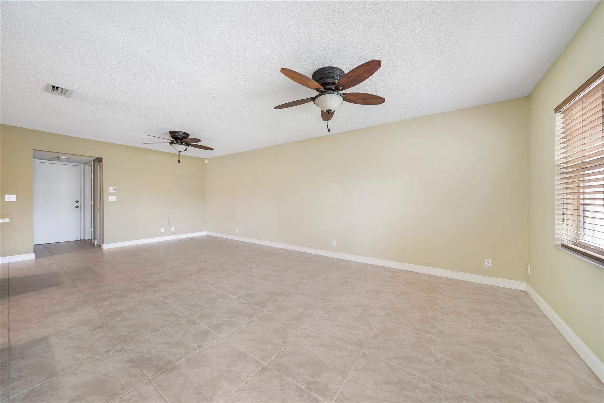10423 Boca Springs Drive Boca Raton, FL 33428 - Photo 13 of 64 an empty room with a window and a ceiling fan