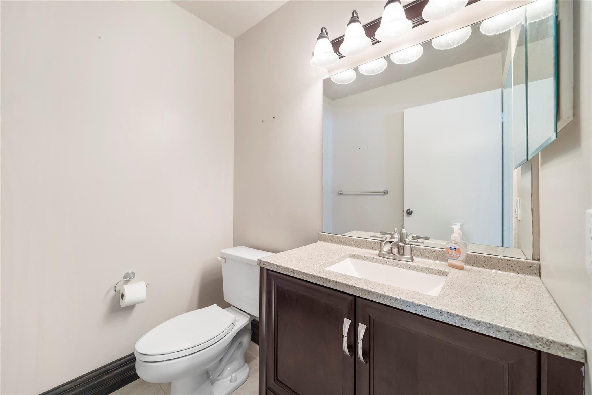 10423 Boca Springs Drive Boca Raton, FL 33428 - Photo 14 of 64 a bathroom with a sink vanity and a toilet