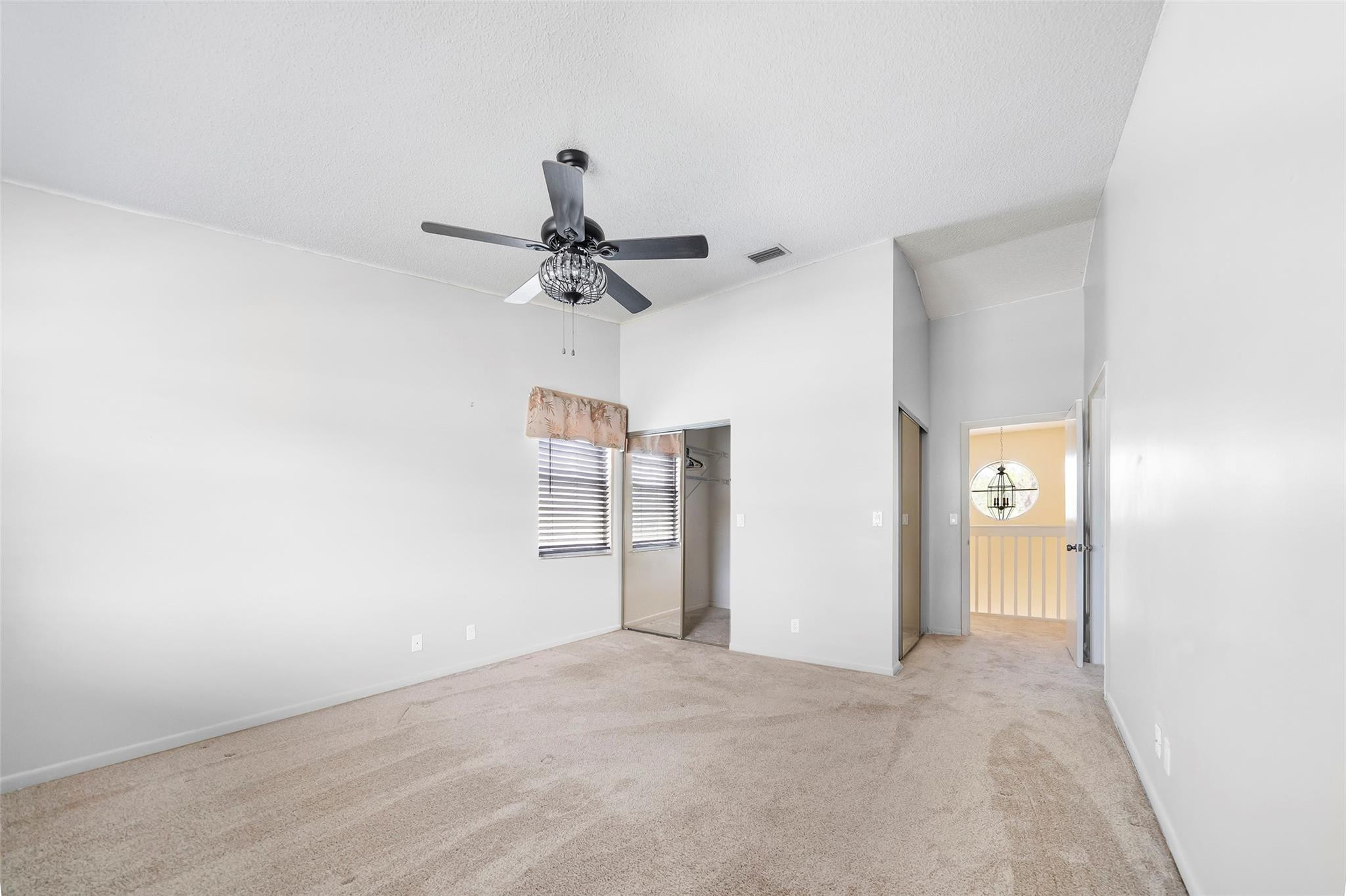10423 Boca Springs Drive Boca Raton, FL 33428 - Photo 24 of 64 a view of a room with a stylish ceiling fan