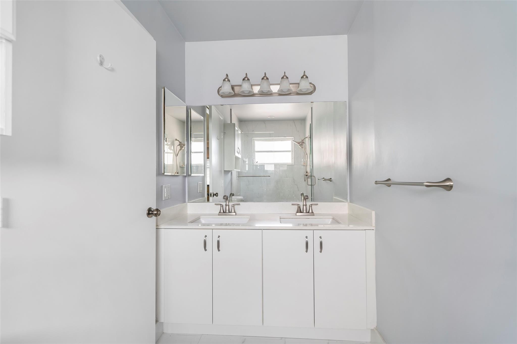 10423 Boca Springs Drive Boca Raton, FL 33428 - Photo 26 of 64 a bathroom with a sink mirror and a