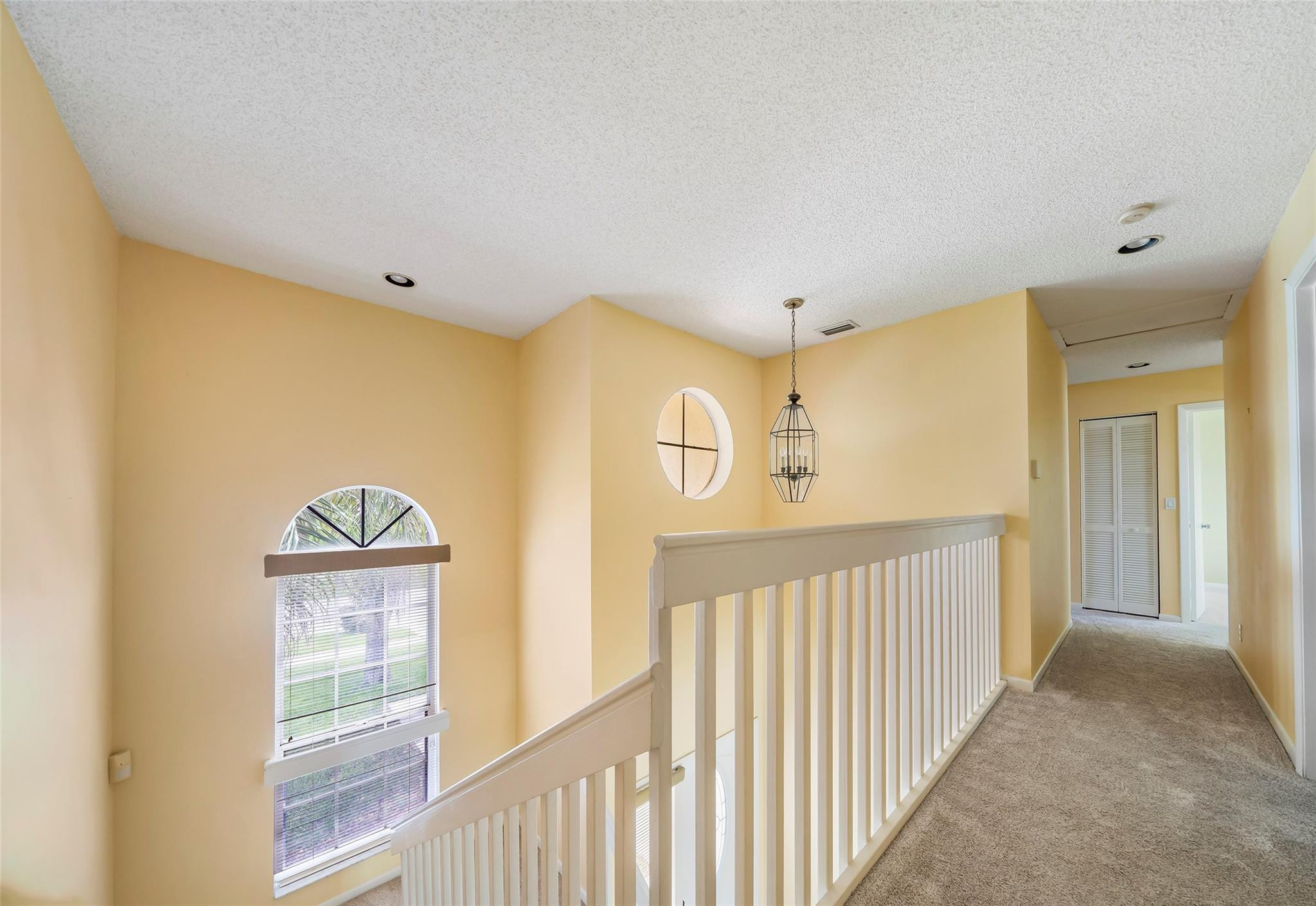10423 Boca Springs Drive Boca Raton, FL 33428 - Photo 28 of 64 a view of a hallway with windows