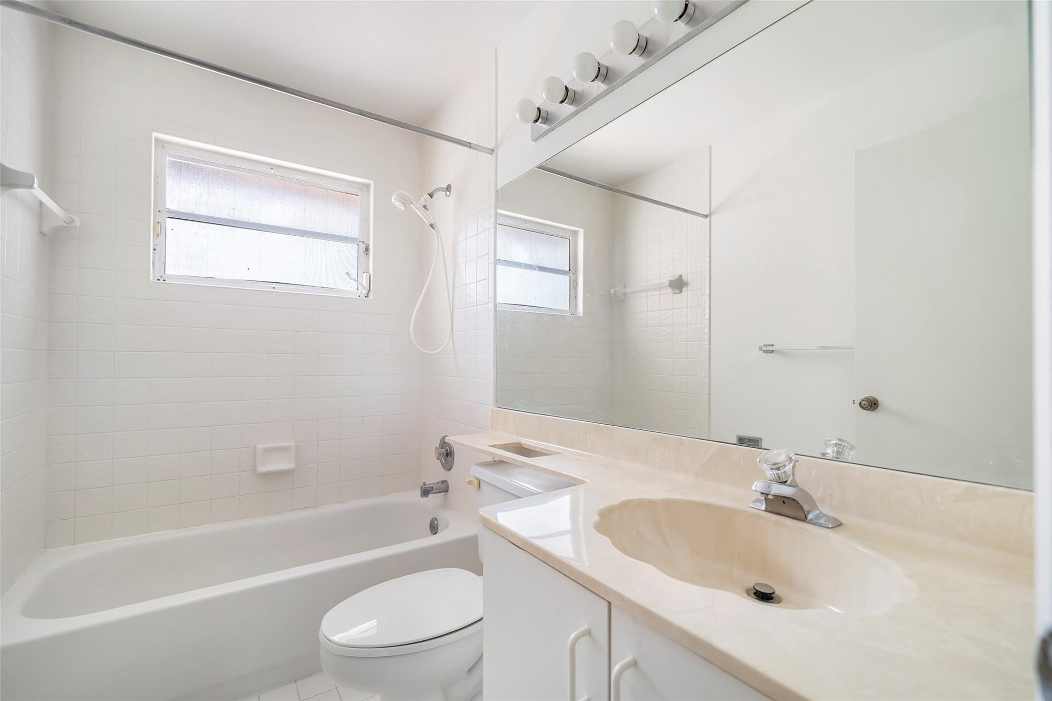 10423 Boca Springs Drive Boca Raton, FL 33428 - Photo 32 of 64 a bathroom with a sink toilet and shower