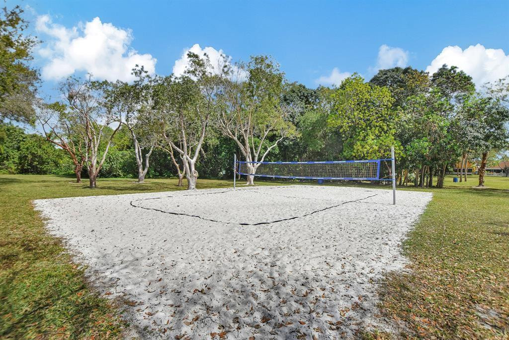10423 Boca Springs Drive Boca Raton, FL 33428 - Photo 55 of 64 a house with trees in the background