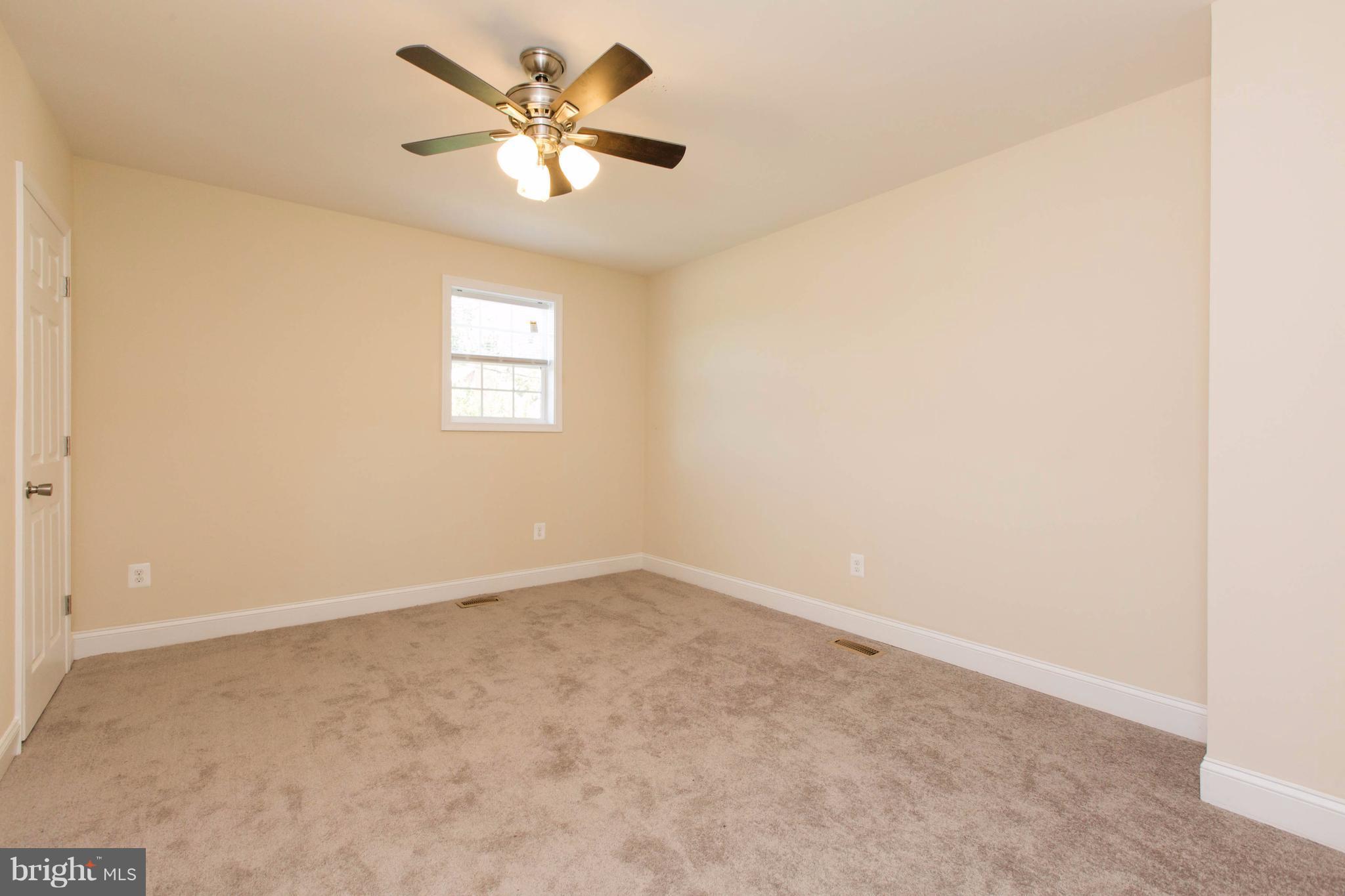 2016 Sulphur Spring Road Halethorpe, MD 21227 - Photo 22 of 30 an empty room with a window and a fan