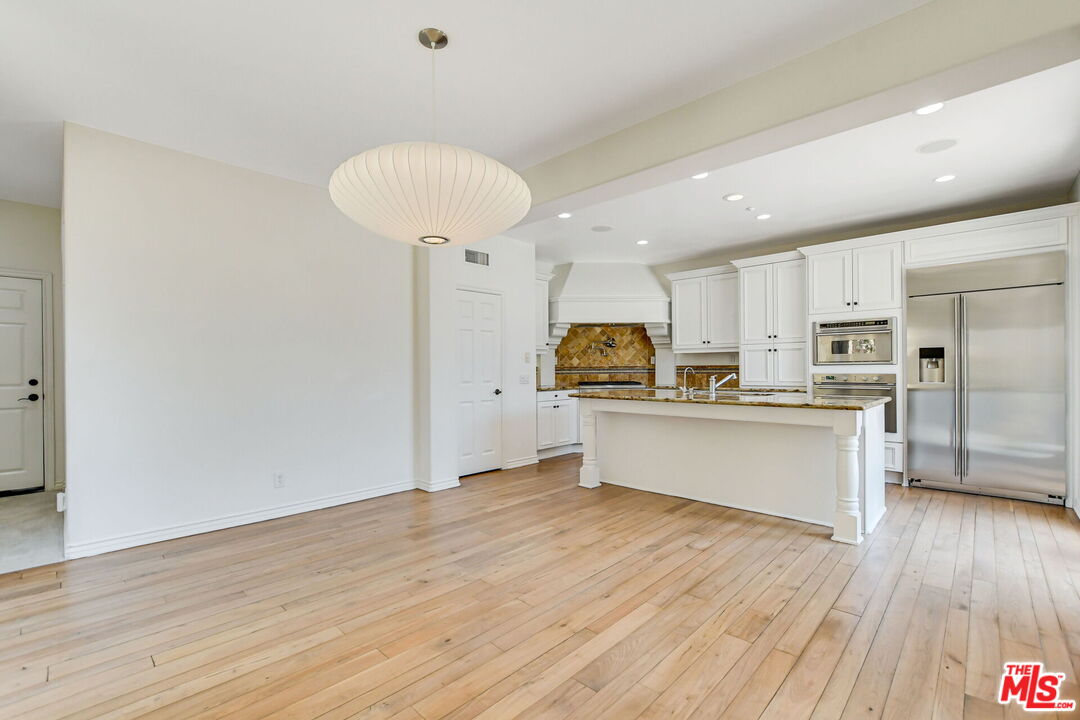 24 Still Water Newport Coast, CA 92657 - Photo 11 of 56 a kitchen with stainless steel appliances a refrigerator and a microwave