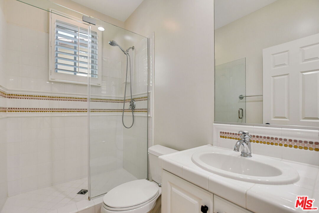 24 Still Water Newport Coast, CA 92657 - Photo 26 of 56 a bathroom with a sink toilet and shower