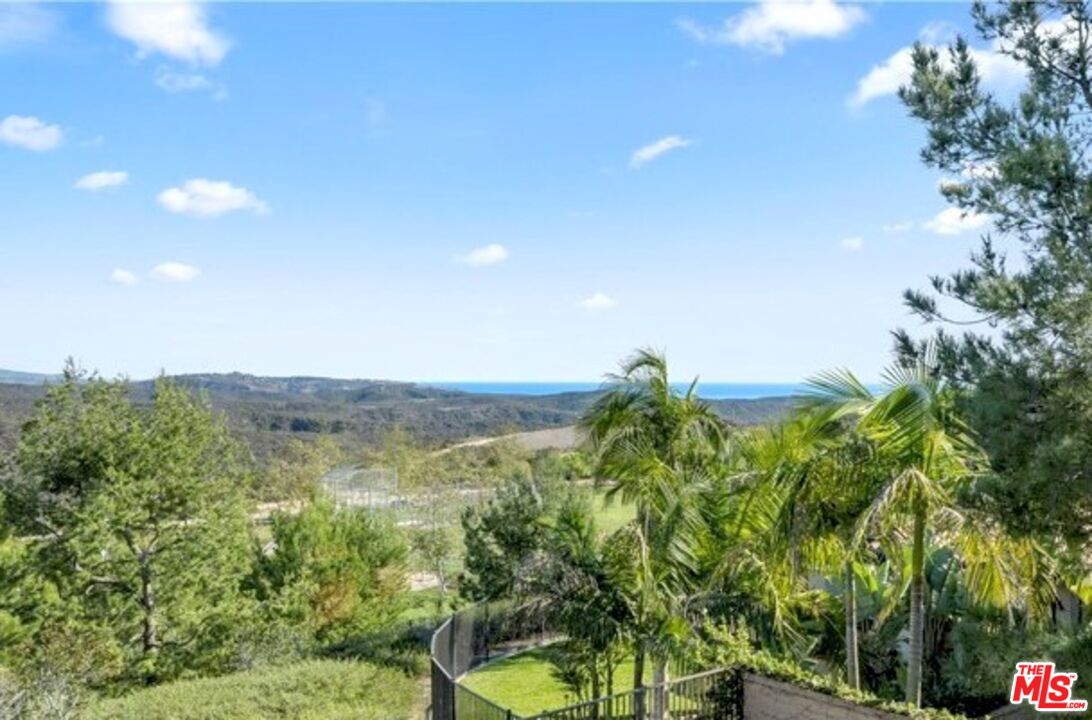 24 Still Water Newport Coast, CA 92657 - Photo 33 of 56 a view of a lake with a mountain in the background