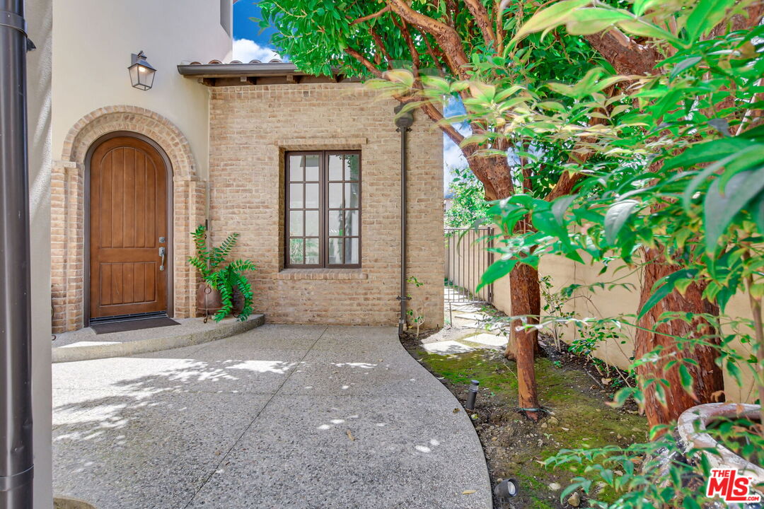 24 Still Water Newport Coast, CA 92657 - Photo 4 of 56 a front view of a house with garden