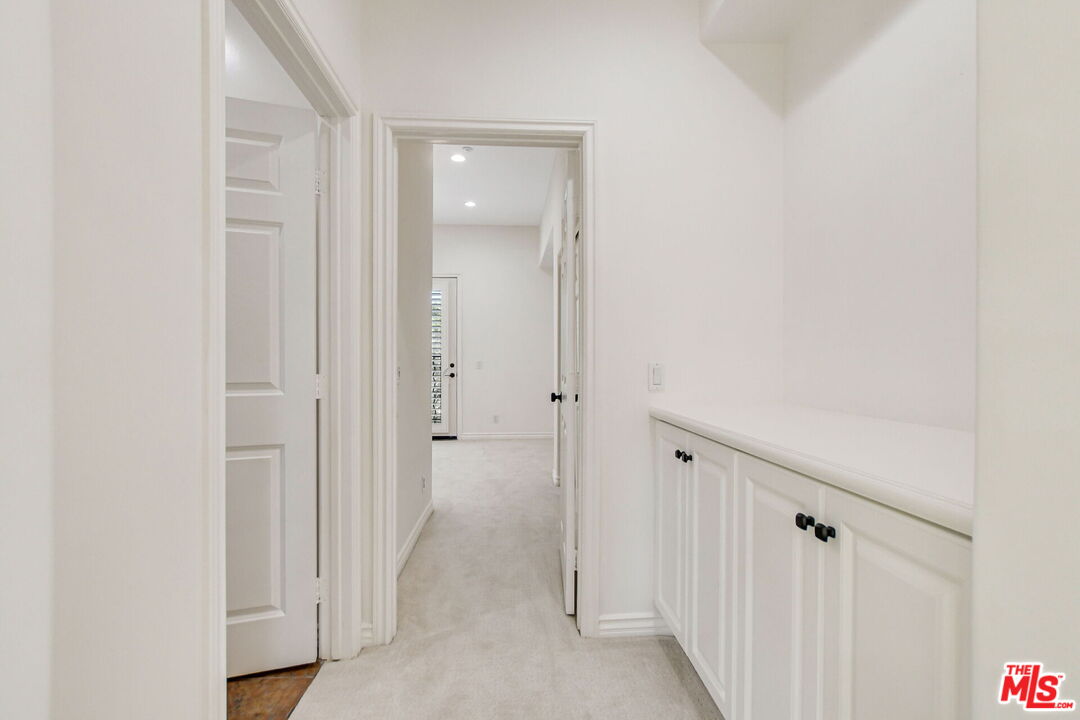 24 Still Water Newport Coast, CA 92657 - Photo 41 of 56 a view of a hallway with wooden floor