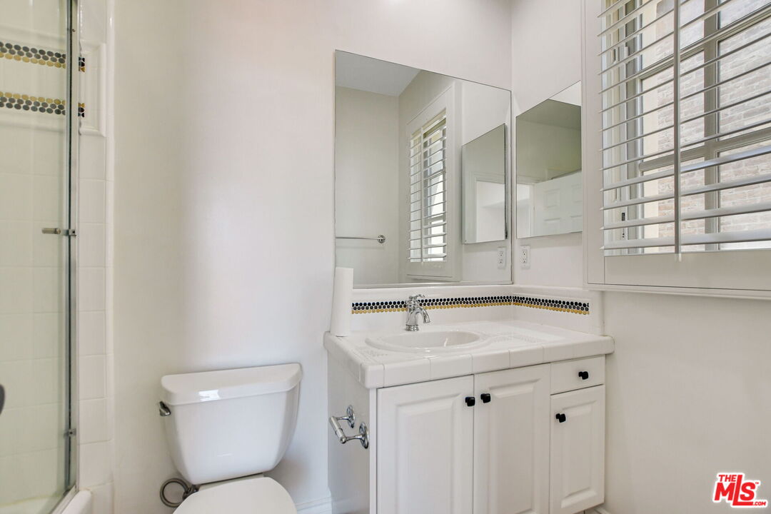 24 Still Water Newport Coast, CA 92657 - Photo 44 of 56 a bathroom with a toilet sink and mirror