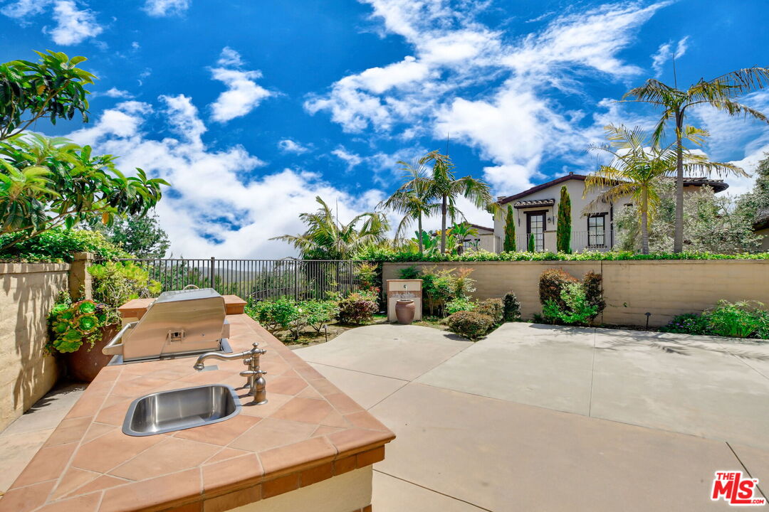 24 Still Water Newport Coast, CA 92657 - Photo 50 of 56 a front view of a house with yard