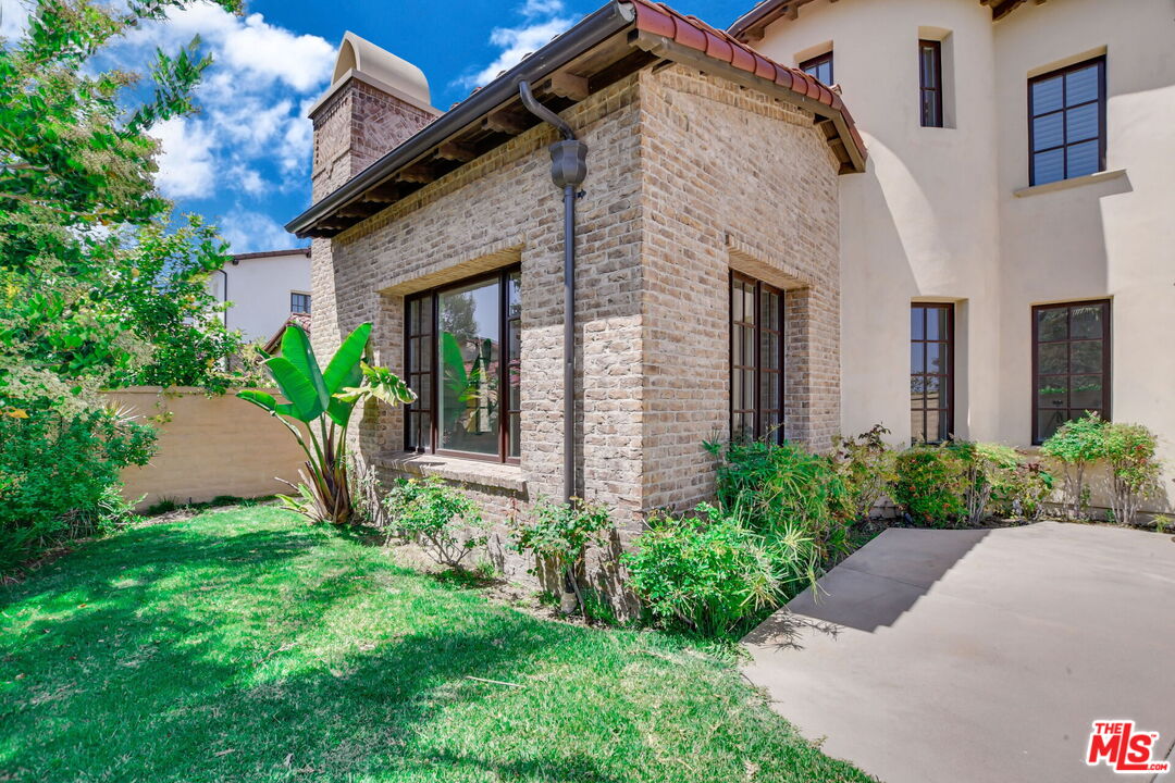 24 Still Water Newport Coast, CA 92657 - Photo 53 of 56 a front view of a house with garden