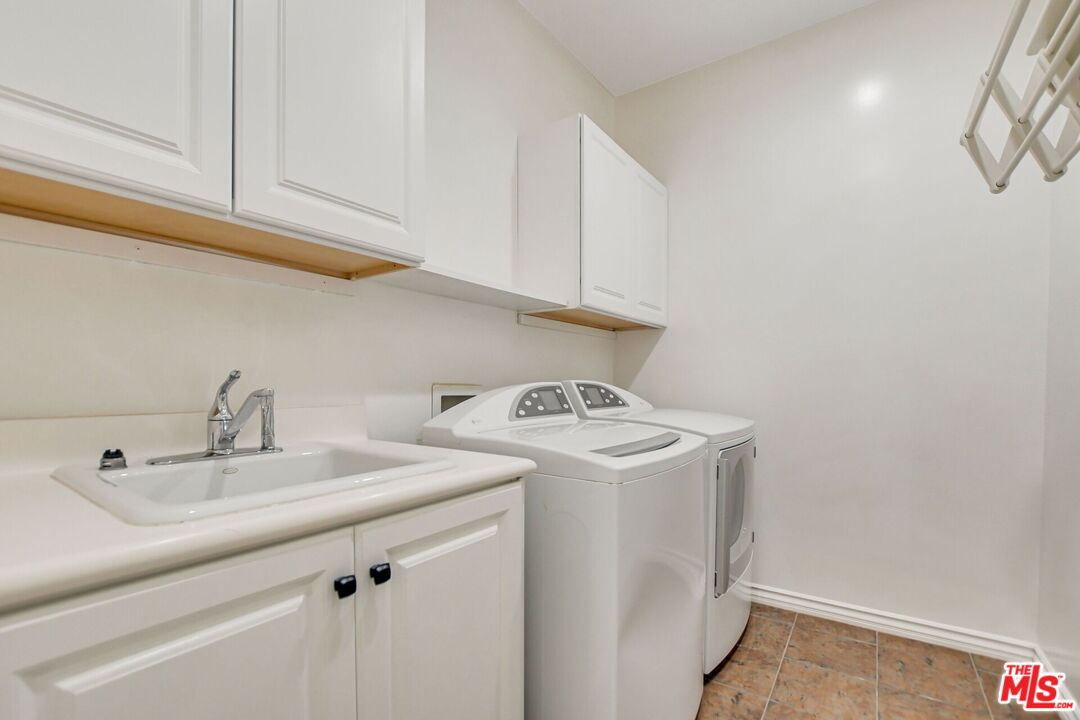 24 Still Water Newport Coast, CA 92657 - Photo 56 of 56 a utility room with sink dryer and washer