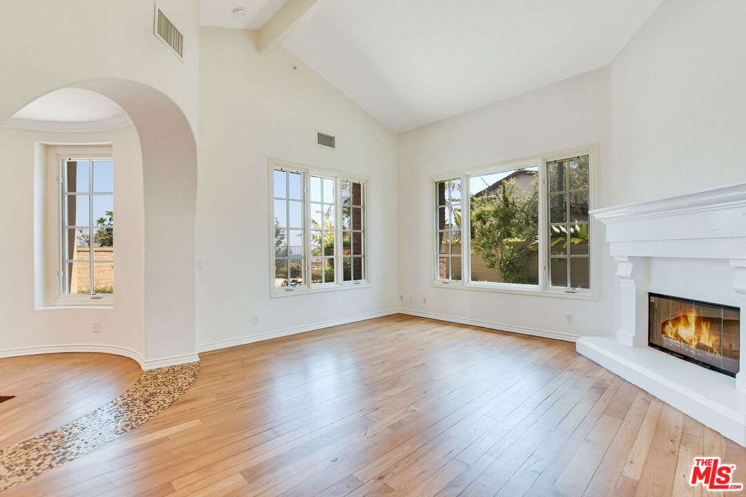 24 Still Water Newport Coast, CA 92657 - Photo 8 of 56 a view of an empty room with window and wooden floor