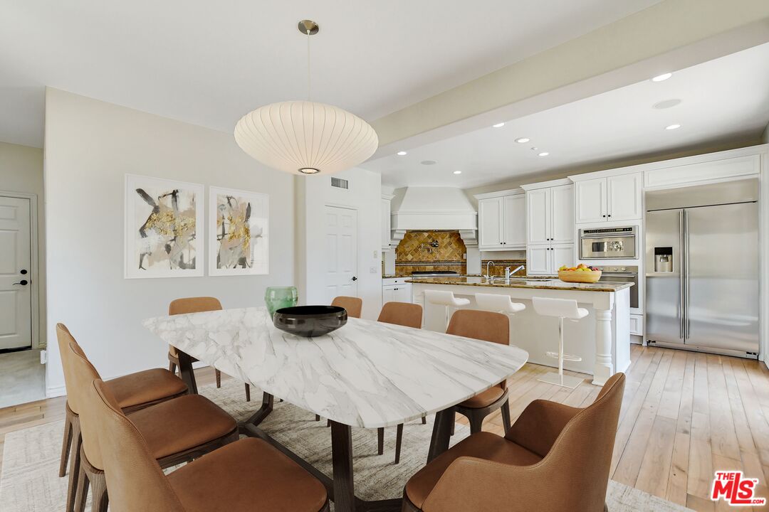 24 Still Water Newport Coast, CA 92657 - Photo 10 of 56 a view of a dining room with furniture and wooden floor