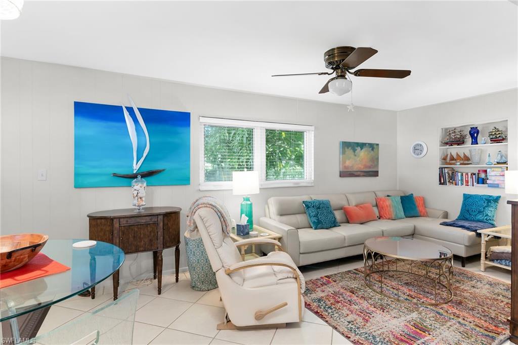 1337 Wisconsin Drive Naples, FL 34103 - Photo 16 of 35 a living room with furniture and a window