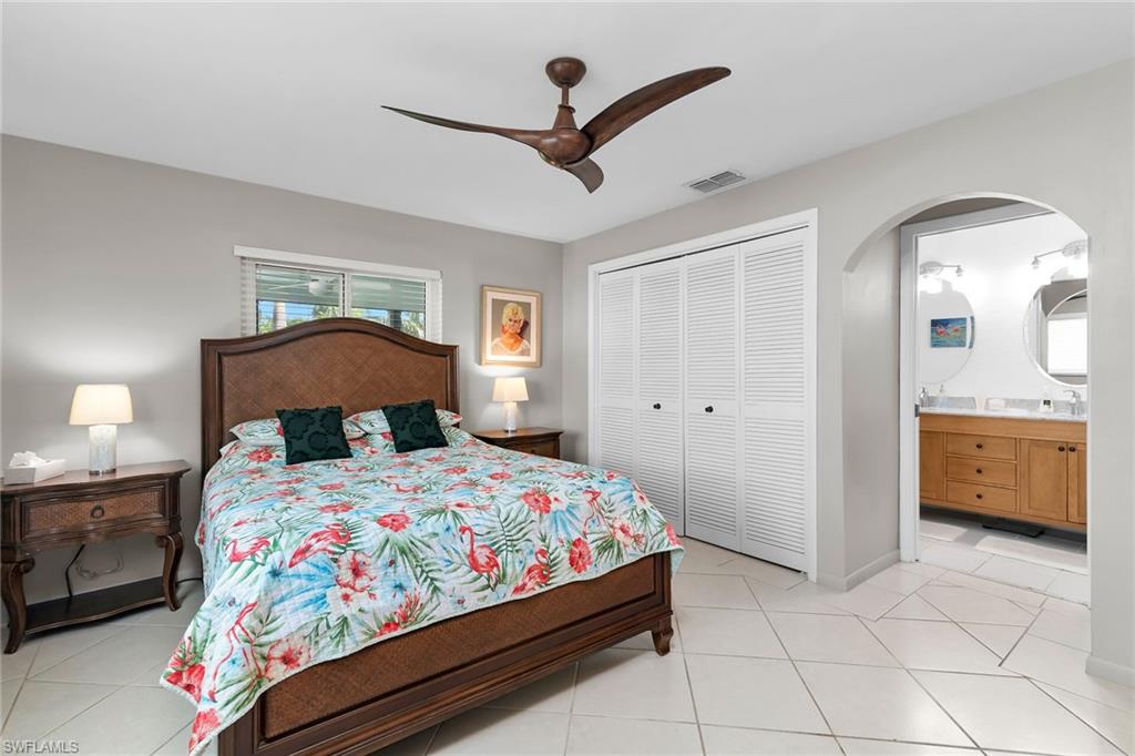 1337 Wisconsin Drive Naples, FL 34103 - Photo 18 of 35 a bedroom with a bed and a view of bedroom