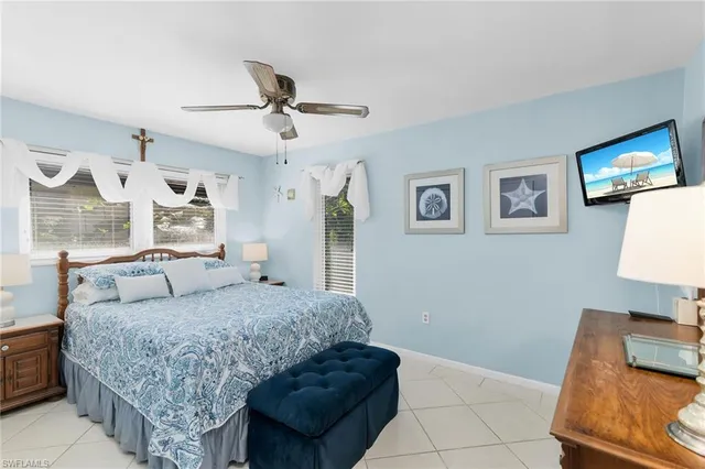 a living room with a couch and a lamp