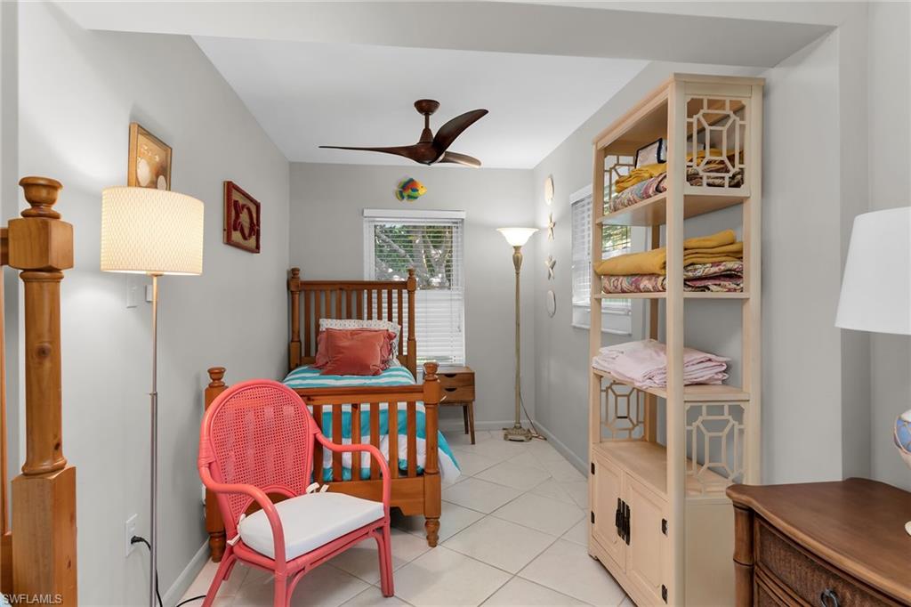 1337 Wisconsin Drive Naples, FL 34103 - Photo 24 of 35 a bedroom with furniture and a window