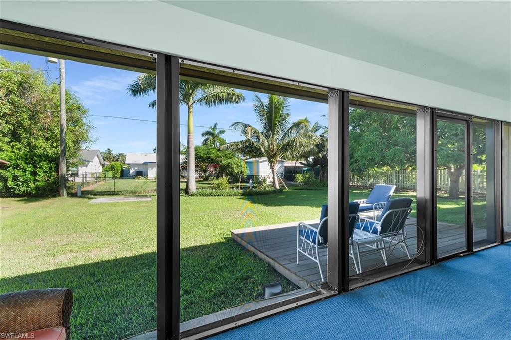 1337 Wisconsin Drive Naples, FL 34103 - Photo 27 of 35 a view of a room with yard from a ceiling window
