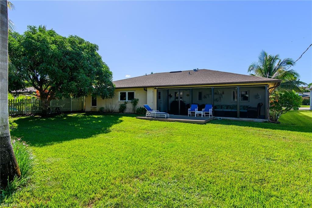 1337 Wisconsin Drive Naples, FL 34103 - Photo 28 of 35 a front view of a house with a yard