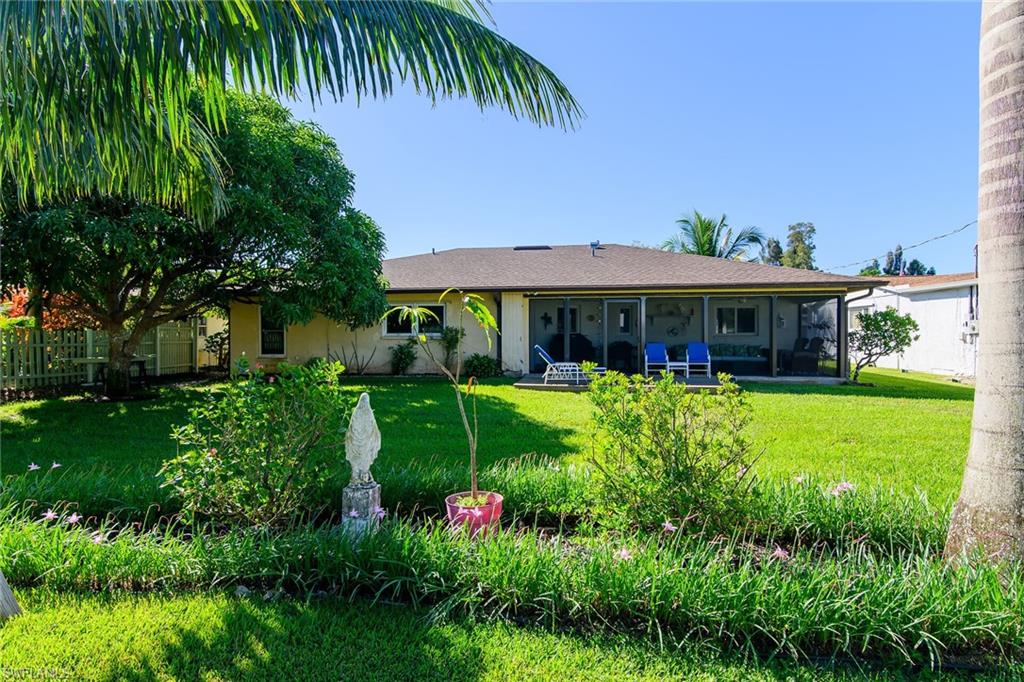 1337 Wisconsin Drive Naples, FL 34103 - Photo 29 of 35 a view of house with a garden