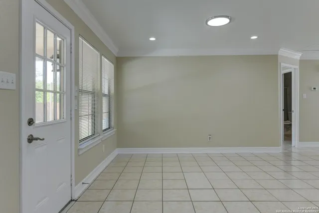 a view of an empty room and window
