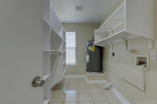 a view of a porch with wooden floor and floor to ceiling window