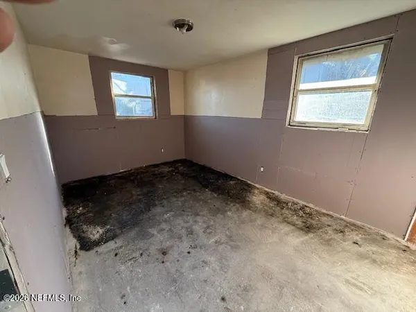 a bathroom with a sink and mirror
