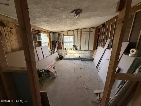 a view of a hallway with windows